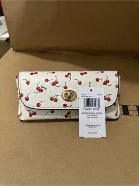 Coach Sunglass Case
With Cherry Print